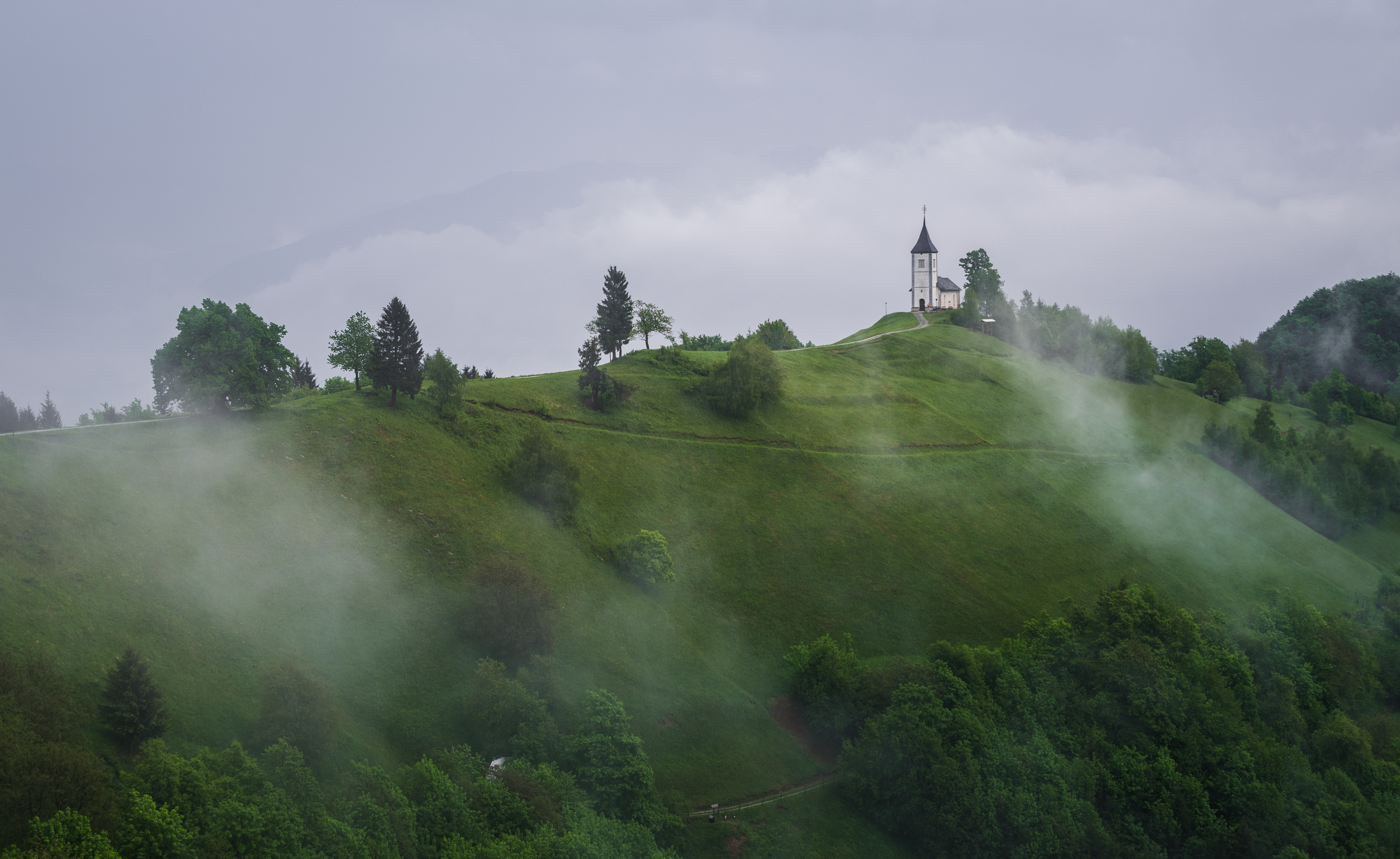 Church on the hill on a stormy summer day